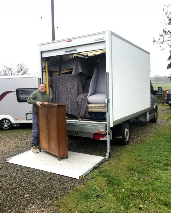 Green4Logistics team member loading a bookcase into our removal van on a Staffordshire Moorlands move near Leek