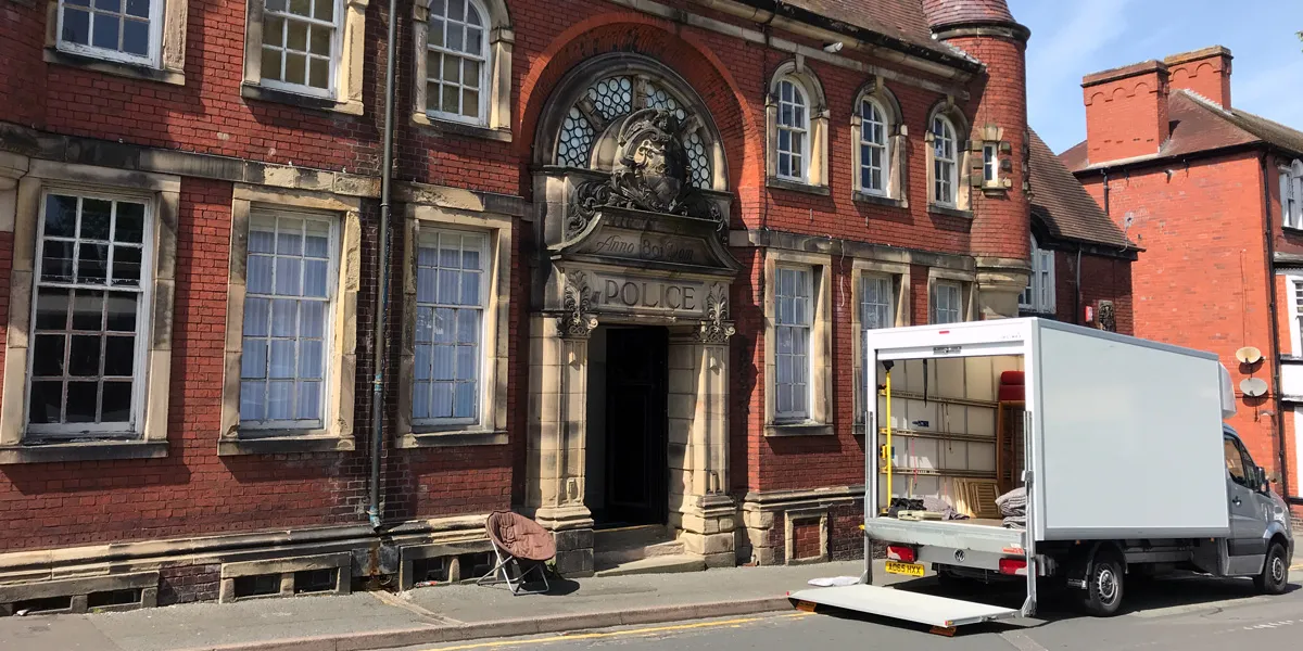 Green4Logistics removal van loading on a street near Leek town centre