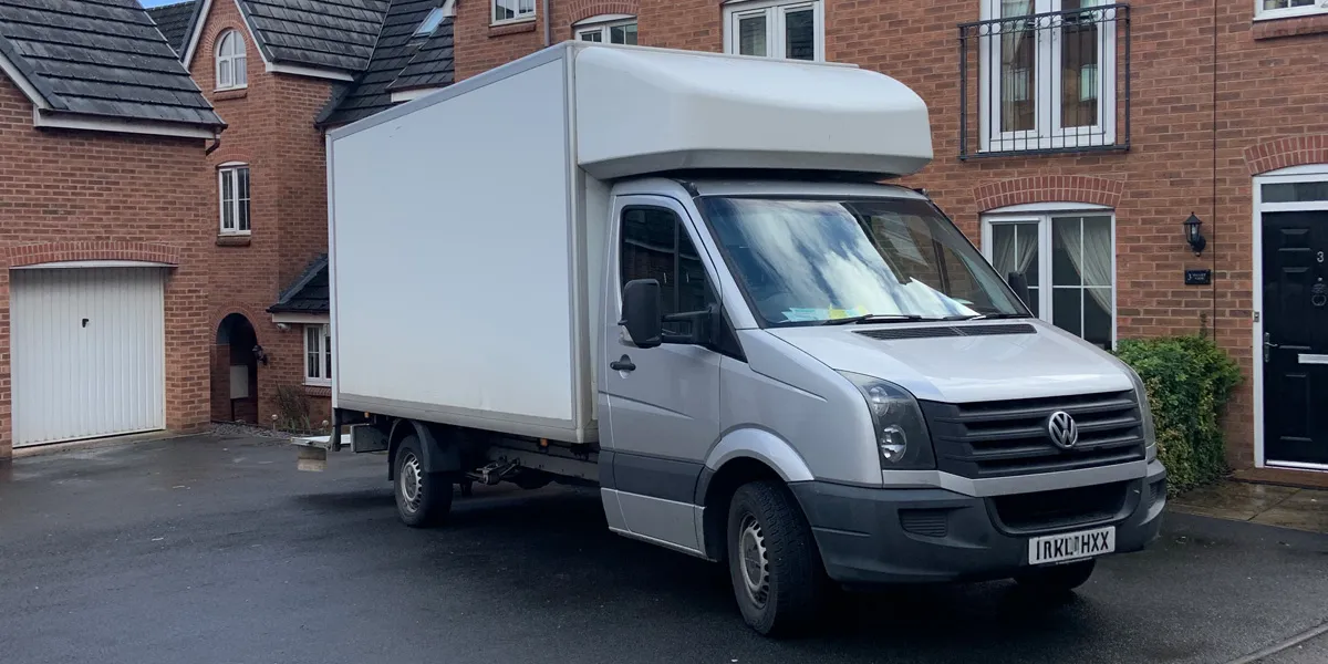 Green4Logistics removal van on a residential street in Newcastle-under-Lyme