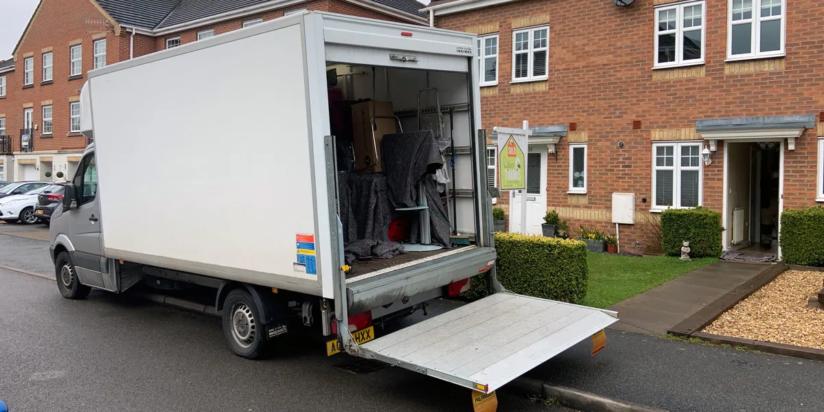 Green4Logistics removal van on a residential street